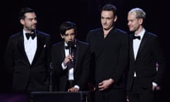 Matty Healy (second from left) accepts the Brit award for best British group, 20 February 2019.