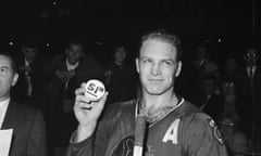 Bobby Hull Holding Record-Breaking Puck<br>(Original Caption) Bobby Hull, of the Black Hawks, is the happiest man in town, smiling and holding the puck with which he shattered the all-time National Hockey League record for goals in one season when he netted number 51 on Chicago Stadium ice 3/12. He had been tied with two other players at 50 goals.