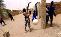 Children play football on the street near houses in Khartoum<br>Gassim Osman, 13, scores a goal as children play football on the street near houses in Khartoum, Sudan May 14, 2018. Gassim said “I wish to play soccer with the Bayern Munich football team”. The eyes of the world will turn to Russia this week for the four-yearly gathering of soccer’s superstars but it is away from the glitzy new stadiums built at a staggering cost you must look to find the sport’s beating heart; to the dusty streets and poverty-wracked neighbourhoods where the simple act of scoring a goal can still transcend the grind of everyday life. Picture taken May 14, 2018. REUTERS/Mohamed Nureldin Abdallah TO FIND ALL PICTURES SEARCH “SOCCER-WORLDCUP/STREETGOALS\