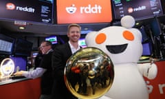 Steve Huffman, CEO of Reddit, stands next to Snoo, the mascot of Reddit, at the NYSE in New York City.