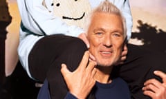 Roman Kemp sitting on Martin Kemp's shoulders outside with a dramatic sky in 1997 and 2024.