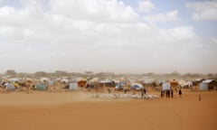 FILE - In this Sunday, Aug. 7, 2011 file photo, Somali refugees herd their goats at the Ifo refugee camp outside Dadaab, eastern Kenya, 100 kilometers (62 miles) from the Somali border. Kenya's interior minister said Wednesday, May 11, 2016 that the government will close Dadaab refugee camp which has hundreds of thousands of Somali refugees and is often referred to as the world's largest refugee camp. (AP Photo/Jerome Delay, File)