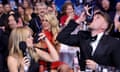 Kylie Minogue and Roman Kemp upholds the fine Australian traditions of the shoey during the 2024 Brit awards on Saturday.