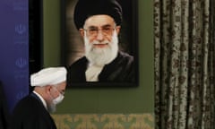Iranian president Hassan Rouhani in front of a portrait of Iran’s supreme leader, Ayatollah Ali Khamenei. 