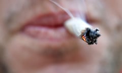 A man smokes a cannabis joint