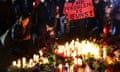 Eleven Killed In Mass Shooting At Lunar New Year Festival In California<br>MONTEREY PARK, CALIFORNIA - JANUARY 24: People attend a candlelight vigil for victims of a deadly mass shooting at a ballroom dance studio, as a person holds a sign reading "The Problem Is Guns!", on January 24, 2023 in Monterey Park, California. Eleven people died and nine more were injured at the studio near a Lunar New Year celebration last Saturday night. Vice President Kamala Harris is scheduled to visit the predominantly Asian American community tomorrow. (Photo by Mario Tama/Getty Images)