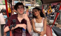 Jay and Veena sitting in a tuk tuk visiting Delhi.