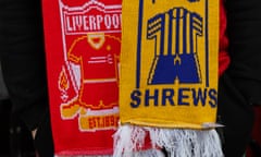 Liverpool v Shrewsbury Town: The Emirates FA Cup Third Round<br>LIVERPOOL, ENGLAND - JANUARY 09: A fan of Liverpool wearing a bar scarf during the Emirates FA Cup Third Round match between Liverpool and Shrewsbury Town at Anfield on January 9, 2022 in Liverpool, England. (Photo by Matthew Ashton - AMA/Getty Images)