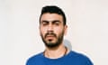Head shot of Palestinian actor Mo'min Swaitat in dark blue T-shirt against white background