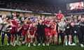 Crawley’s manager, Scott Lindsey, celebrates with players and staff in front of the fans after winning the League Two playoff semi-final against MK Dons