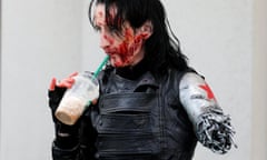 Dawn Richardson grabs a Starbucks drink in the costume of the Winter Soldier at the pop culture event Comic-Con International in San Diego, California, United States July 22, 2016. REUTERS/Mike Blake