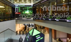 Share prices are seen on screens at the London Stock Exchange