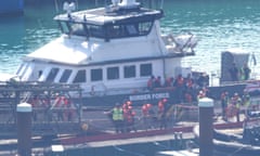 A group of people thought to be migrants brought  in to Dover, Kent, by a Border Force vessel