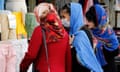 Women wearing face masks go shopping in Tehran