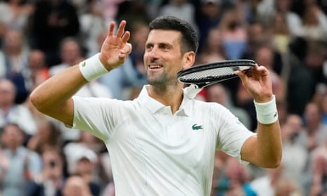 Novak Djokovic of Serbia laughs and looks to his player's box after beating Alexei Popyrin