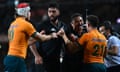 Australia’s Nic White scuffles with New Zealand’s Caleb Clarke during the second rugby Test match against New Zealand at Eden Park. Follow live scores from the All Blacks vs Wallabies game in Auckland.