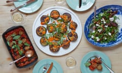 A table laid with dishes of aubergine and almond cakes; aubergine wedge salad with pine nuts and ricotta; and aubergine polpette.