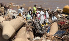 Rescue teams and members of Libyan Red Crescent search for dead bodies at a beach, in the aftermath of the floods in Derna.