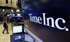 FILE - In this Thursday, June 15, 2017, file photo, the Time Inc. logo appears above a trading post on the floor of the New York Stock Exchange. Time Inc. is considering a sale to fellow publisher Meredith Corp., according to media reports, Thursday, Nov. 16, 2017. Time and Meredith both declined comment on the reports. (AP Photo/Richard Drew, File)