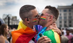 Gay Pride Is Celebrated In London<br>LONDON, ENGLAND - JUNE 27: A couple kiss in Trafalgar Square after the annual Pride in London Parade on June 27, 2015 in London, England. Pride in London is one of the world's biggest LGBT+ celebrations as thousands of people take part in a parade and attend performances at various locations across the city. (Photo by Rob Stothard/Getty Images)