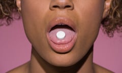 Woman with pill on tongue<br>GettyImages-86536120