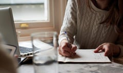 Woman Writing Notes In Business Meeting<