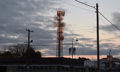 A communications tower is seen at sunset in the NSW outback town of Bourke