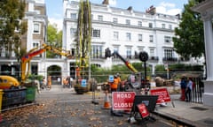 Photos of the large crane used to lift trees over the houses on the east side of Onslow Square