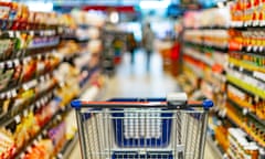 A shopping trolley in a supermarket aisle