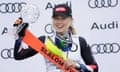Mikaela Shiffrin celebrates on the podium after her record-extending 60th slalom win at the World Cup finals on Saturday.