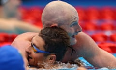 Rowan Crothers of Australia congratulates Ukraine’s Maksym Krypak, who swam a world record time in the men’s S10 100m freestyle. 
