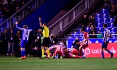 Atlético Madrid players crowd around Fernando Torres after he was knocked unconscious against Deportivo La Coruna on 2 March.