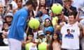 Novak Djokovic signs autographs after defeating Bernabe Zapata Miralles during their Second Round match on Day Two of the 2023 US Open.