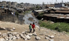 Boys walk the Mathare valley slums in Kenya's capital Nairobi, July 11, 2015. REUTERS/Thomas Mukoya