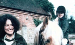 Lin Russell stands next to Megan, who is on a horse