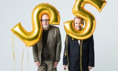 Vic Reeves and Bob Mortimer with large balloons in the shape of the numbers two and five on their heads