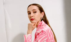 Rose Ayling-Ellis crouched down wearing mint-green platform sandals and a mini dress with a pink and white swirl pattern