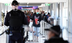 police screen incoming passengers at an airport