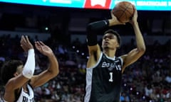 The Spurs' Victor Wembanyama shoots over the Blazers' Justin Minaya during the second half of Sunday’s game.