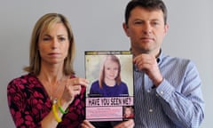 Kate and Gerry McCann hold an age-progressed police image of Madeleine