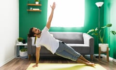 A man doing a side plank yoga exercise