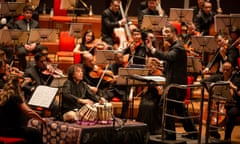 tabla maestro Zakir Hussain, centre, with the Symphony Orchestra of India conducted by Zane Dalal at Symphony Hall, Birmingham.