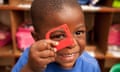 Child looking through toy frame, smiling<br>CPX8EB Child looking through toy frame, smiling