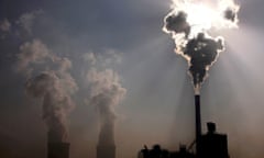 A coal-burning power plant can be seen behind a factory in China’s Inner Mongolia Autonomous Region, October 31, 2010.