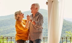 Senior couple dancing on balcony at home
