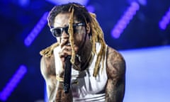 Lil Wayne<br>FILE - In this June 25, 2016 file photo, Lil Wayne performs at the 2016 BET Experience in Los Angeles. The rapper got some backlash when he told  Fox Sports 1’s “Undisputed” that there was “no such thing as racism” because his concert audiences had a a lot of white fans. He also said he had never dealt with racism. Lil Wayne said Tuesday, Oct. 11, that one of the reasons he feels that way is because a white police officer saved his life when he was 12-years old after a self-inflicted gunshot wound to the chest.(Photo by Rich Fury/Invision/AP, File)
