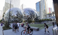 Pedestrians and cyclists gather near the Bezos balls in Seattle