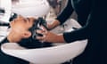 Woman getting her hair washed at a salon