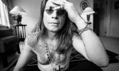 Ozzy Osbourne with bare chest and sunglasses on