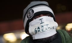 A protestor attends a rally outside the Barclays Center against a grand jury’s decision not to indict the police officer involved in the death of Eric Garner, Monday, Dec. 8, 2014, in the Brooklyn borough of New York. Britain’s Prince William, the Duke of Cambridge, and Kate, Duchess of Cambridge, not pictured, attended a NBA basketball game between the Cleveland Cavaliers and the Brooklyn Nets at Barclays Center. (AP Photo/John Minchillo)